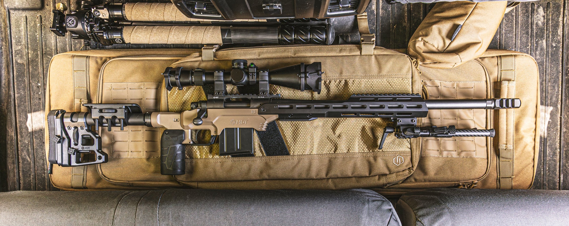 LSS Gen3 rifle in a tan carrying case on a wooden floor