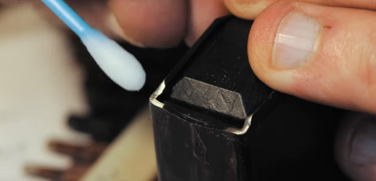 Applying some bluing to protect the metal.